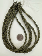 matte dark olive green black, buddha motif,  carved design, vintage look acrylic, 6mm round, 15" strand, sold per strand