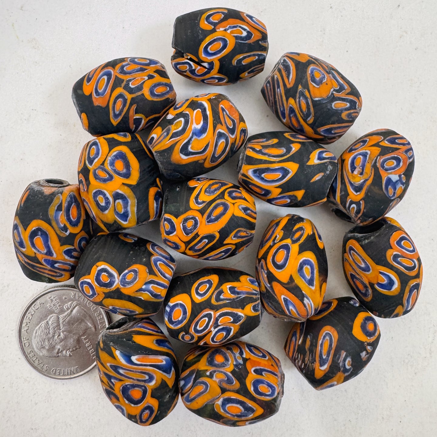 matte orange blue white black millefiori motif, vintage look glass, 24x18mm bowed tube barrel mix, sold per bead