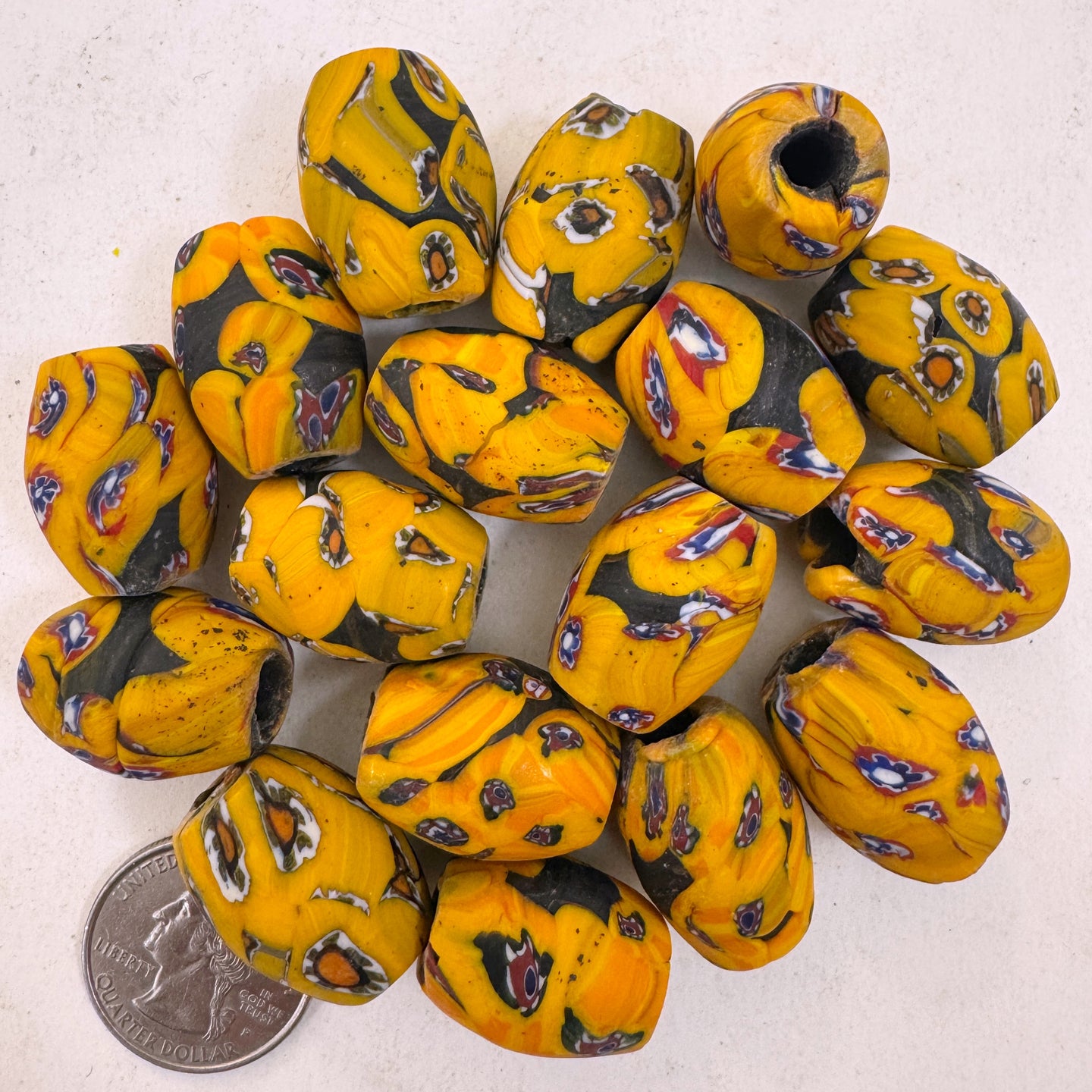 matte pale red orange red blue white black millefiori motif, vintage look glass, 24x18mm bowed tube barrel mix, sold per bead