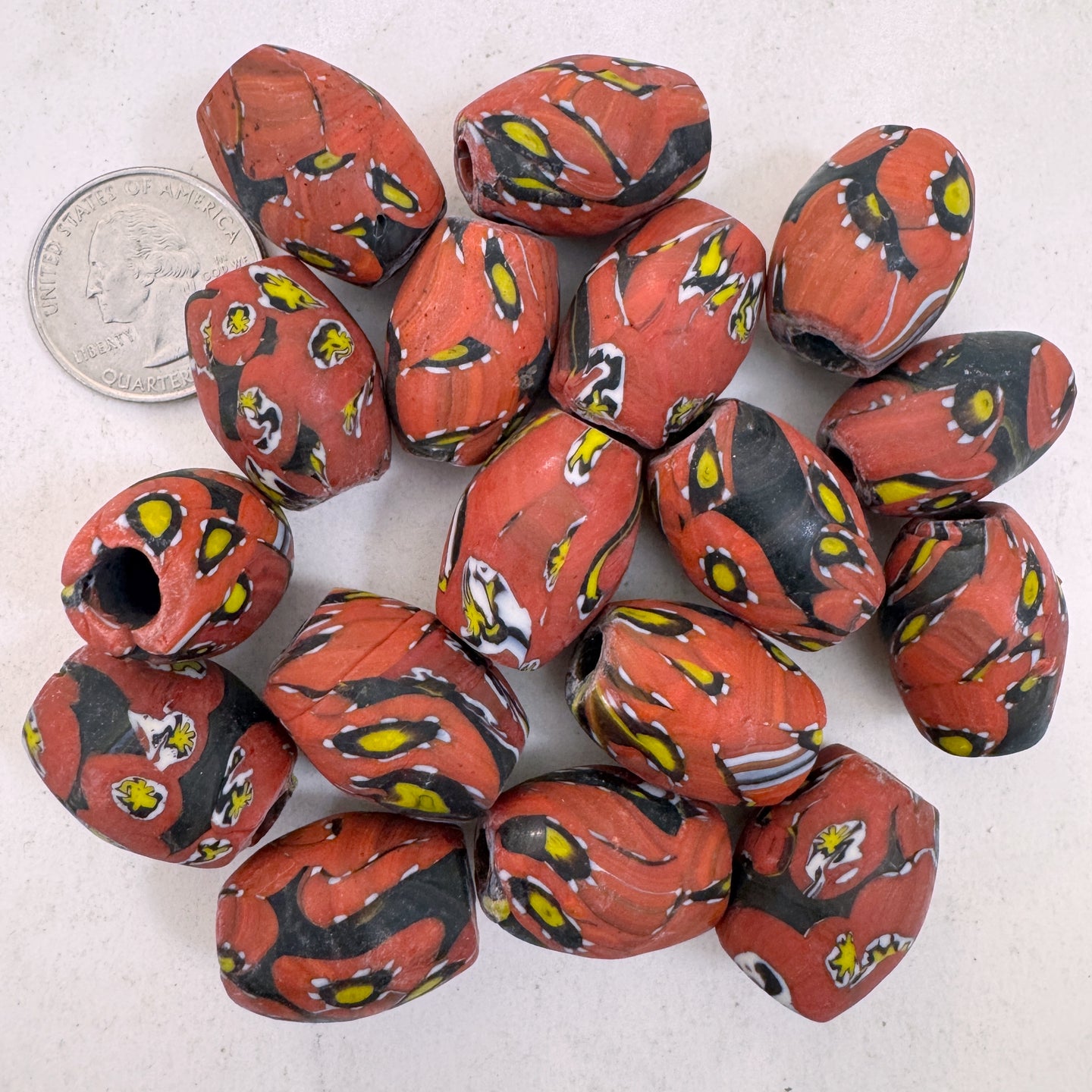 matte pale red yellow white black millefiori motif, vintage look glass, 24x18mm bowed tube barrel mix, sold per bead