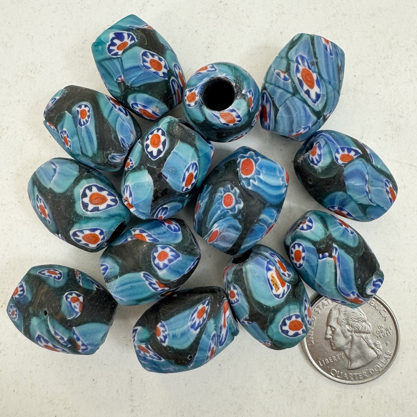 matte pale blue red white black millefiori motif, vintage look glass, 24x18mm bowed tube barrel mix, sold per bead