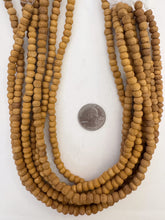 amber enhanced raw wood,  6x5mm rondelle, 15" strand,  SOLD PER STRAND