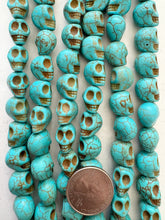 color enhanced magnesite: turquoise blue, 13x13x10mm skull, 15" strand, SOLD PER STRAND