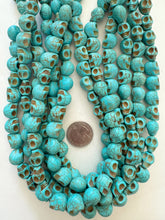 color enhanced magnesite: turquoise blue, 13x13x10mm skull, 15" strand, SOLD PER STRAND