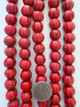 color enhanced magnesite: coral red, 14mm melon cut round, 15" strand, SOLD PER STRAND