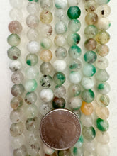 color enhanced quartz: green off white orange mix, 8mm round, 15" strand, SOLD PER STRAND