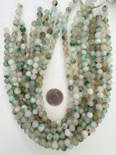 color enhanced quartz: green off white orange mix, 8mm round, 15" strand, SOLD PER STRAND
