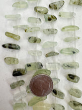 rutilated prehnite, 12x5x4mm - 20x8x4mm stick pendants, 15" strand,  SOLD PER STRAND