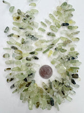 rutilated prehnite, 12x5x4mm - 20x8x4mm stick pendants, 15" strand,  SOLD PER STRAND