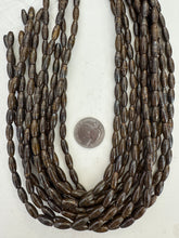bronzite, 12x5mm bowed rice tube, 15" strand,  SOLD PER STRAND