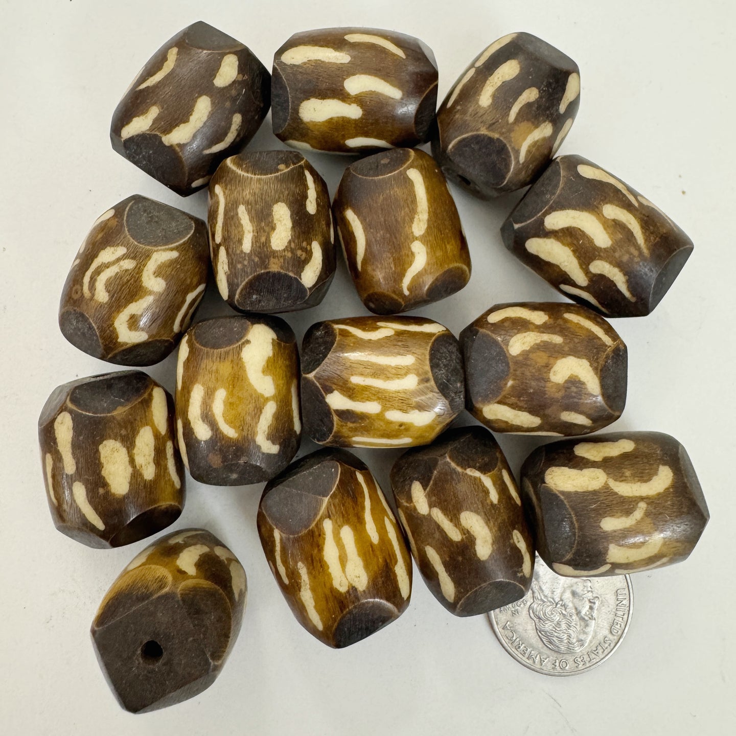 brown off white, curled lines motif, faux bone look, vintage stock resin, 24x18mm barrel, sold per bead