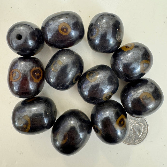 brown dark amber, evil eye motif, faux bone look, vintage stock resin, 26x23mm barrel, sold per bead