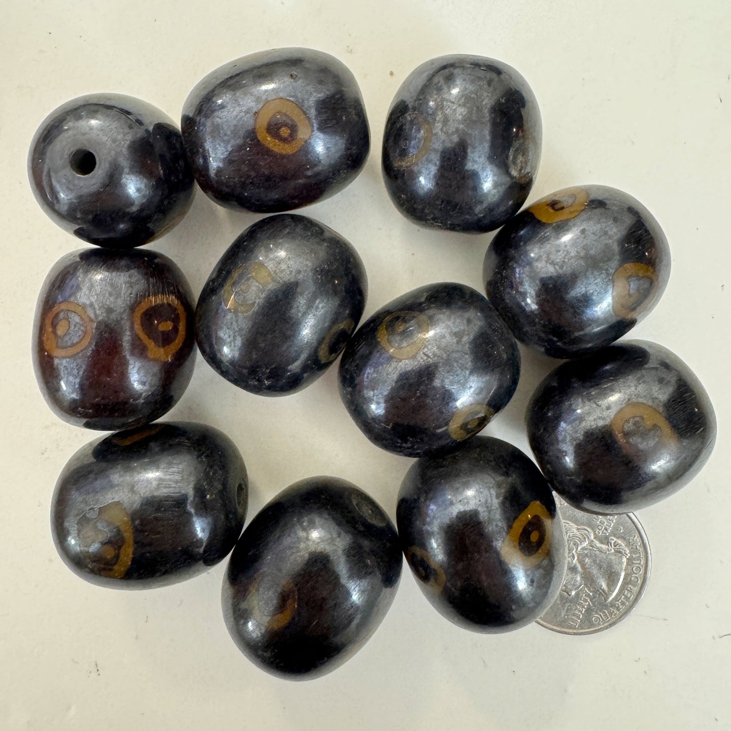 brown dark amber, evil eye motif, faux bone look, vintage stock resin, 26x23mm barrel, sold per bead