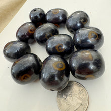 brown dark amber, evil eye motif, faux bone look, vintage stock resin, 26x23mm barrel, sold per bead