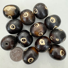 brown off white, evil eye motif, faux bone look, vintage stock resin, 26x23mm barrel, sold per bead