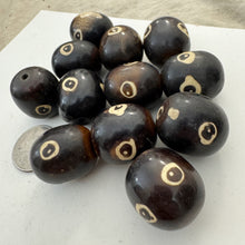 brown off white, evil eye motif, faux bone look, vintage stock resin, 26x23mm barrel, sold per bead