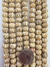 off white brown, carved crossing lines eye motif, vintage stock bone, 10x8mm rondelle, 15" strand, SOLD PER STRAND
