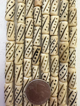 off white black, carved dots lines motif, vintage stock bone, 21x8mm tube, 15" strand, SOLD PER STRAND