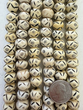 off white black, carved eye motif, vintage stock bone, 15x11mm rondelle, 12.5" strand, SOLD PER STRAND