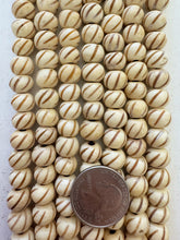 off white browm, carved spiral lines motif, vintage stock bone, 11x8mm rondelle, 15" strand, SOLD PER STRAND