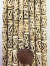 off white brown black, carved line eye motif, vintage stock bone, 21x7mm tube, 15" strand, SOLD PER STRAND