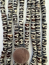 dark brown off white, dot line motif, vintage stock bone, 12x7mm barrel, 15" strand, SOLD PER STRAND