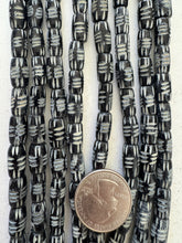black off white, carved lines motif, vintage stock bone, 13x7mm barrel, 15" strand, SOLD PER STRAND