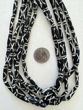 black off white, x motif, vintage stock bone, 25x5mm bowed tube, 15" strand, SOLD PER STRAND