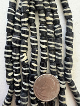 black off white, spiral motif, vintage stock bone, 11x8mm barrel, 15" strand, SOLD PER STRAND