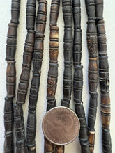 dark brown, carved lines motif, vintage stock bone, 26x8mm bowed tube, 15" strand, SOLD PER STRAND