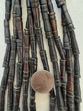 dark brown, carved lines motif, vintage stock bone, 25x6mm pointed tube, 15" strand, SOLD PER STRAND