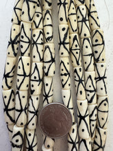 off white black, crossing lines dot motif, vintage stock bone, 25x9mm tube, 15" strand, SOLD PER STRAND