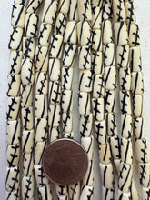 off white black, crossing lines motif, vintage stock bone, 12x5mm tube, 15" strand, SOLD PER STRAND