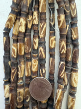 dark brown off white, triangle line motif, vintage stock bone, 25x8mm carved top and bottom tube, 15" strand, SOLD PER STRAND