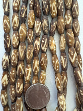 brown off white, dot zig zag lines motif, vintage stock bone, 18x7mm bowed tube, 15" strand, SOLD PER STRAND