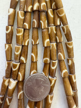 golden brown off white, half circle motif, vintage stock bone, 8x5mm pointed tube, 15" strand, SOLD PER STRAND