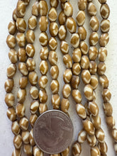 golden brown off white, diamond motif, vintage stock bone, 9x6mm bowed barrel, 15" strand, SOLD PER STRAND