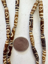golden brown off white, lines eye motif, vintage stock bone, 24x6mm bowed tube, 15" strand, SOLD PER STRAND (batch 1)