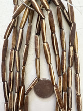 golden brown off white, lines motif, vintage stock bone, 24x6mm bowed tube, 15" strand, SOLD PER STRAND (batch 2)