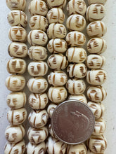 off white brown, carved face motif, vintage stock bone, 12x9mm rondelle, 11" strand, SOLD PER STRAND
