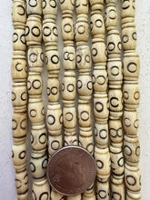 off white brown black, carved circle line motif, vintage stock bone, 13x8mm barrel, 15" strand, SOLD PER STRAND