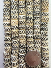 off white brown black, carved x motif, vintage stock bone, 12x7mm rondelle, 15" strand, SOLD PER STRAND