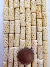 off white, carved dot line motif, vintage stock bone, 21x9mm tube, 15" strand, SOLD PER STRAND