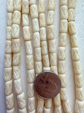 off white, carved x motif, vintage stock bone, 12x6mm tube, 15" strand, SOLD PER STRAND