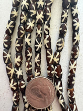dark brown off white, starburst motif, vintage stock bone, 12x6mm rondelle, 15" strand, SOLD PER STRAND