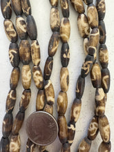 brown off white, mixed spiral designs motif, vintage stock bone, 18x7mm bowed tube, 15" strand, SOLD PER STRAND