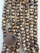 brown off white, dull finish, x dot designs motif, vintage stock bone, 9x7mm rondelle, 15" strand, SOLD PER STRAND