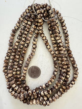brown off white, dull finish, x dot designs motif, vintage stock bone, 9x7mm rondelle, 15" strand, SOLD PER STRAND