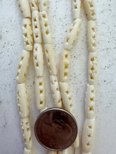 off white, carved open circles x motif, vintage stock bone, 18x5mm tube, 15" strand, SOLD PER STRAND