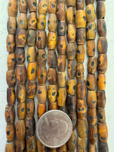 brown black, carved dot motif, vintage stock horn, 16x7mm tube, 15" strand, SOLD PER STRAND